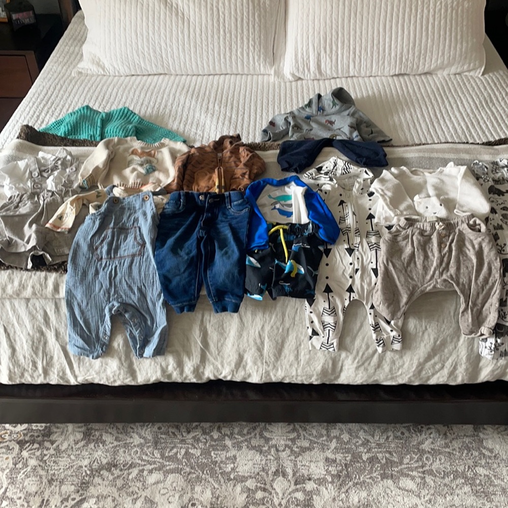 Lot of baby boy clothes.